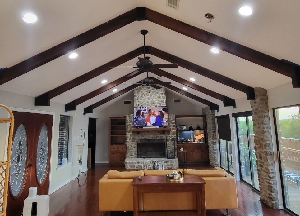 Updated can lights installed new ceiling fans and deleted that old chandelier!